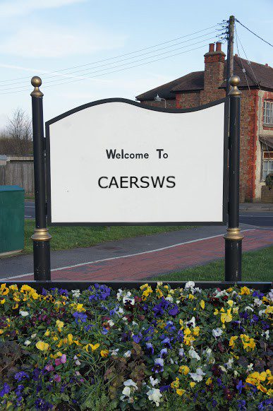 findaskip welcome town sign of caersws
