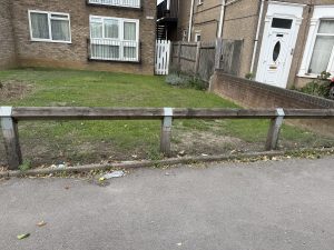 picture of a garden with a low fence.